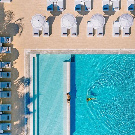 Ivi Mare - Designed For Adults By Louis Hotels Geroskipou Eksteriør billede Aerial view of the pool at the Hotel du Cap-Eden-Roc, Cap d'Antibes, France